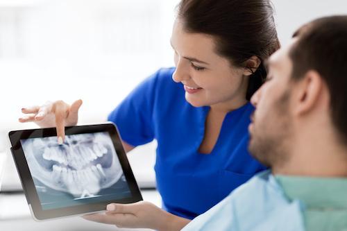 Patient during tooth replacement consultation in Fort Collins, CO