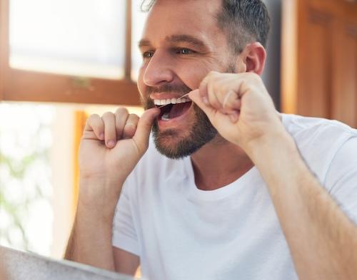 Man flossing in the mirror, fort collins colorado
