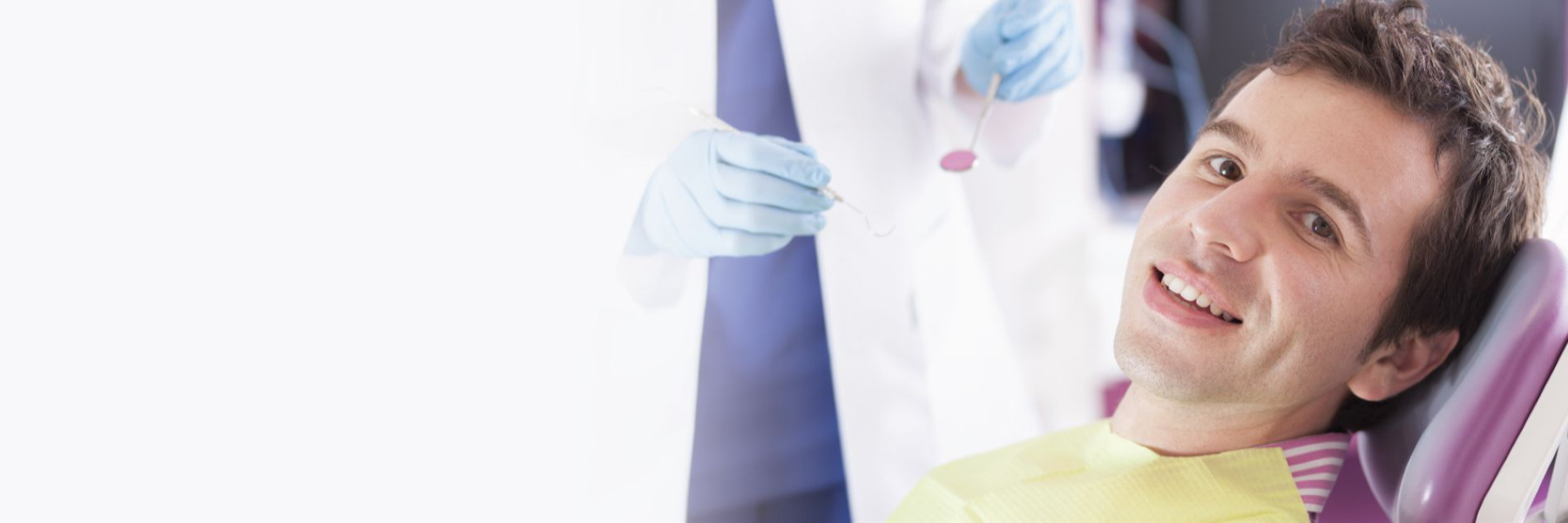 Man with brown hair smiling in the dental chair, fort collins colorado