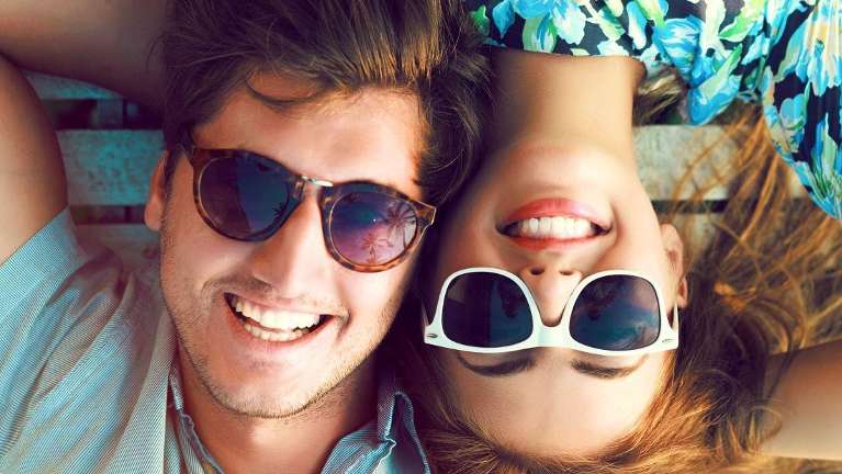 couple smiling with sunglasses on, fort collins co