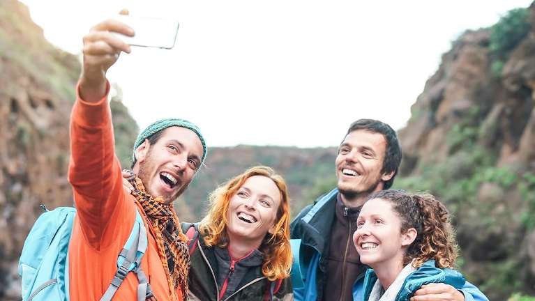 Group of friends taking a selfie together on a hike in fort collins colorado