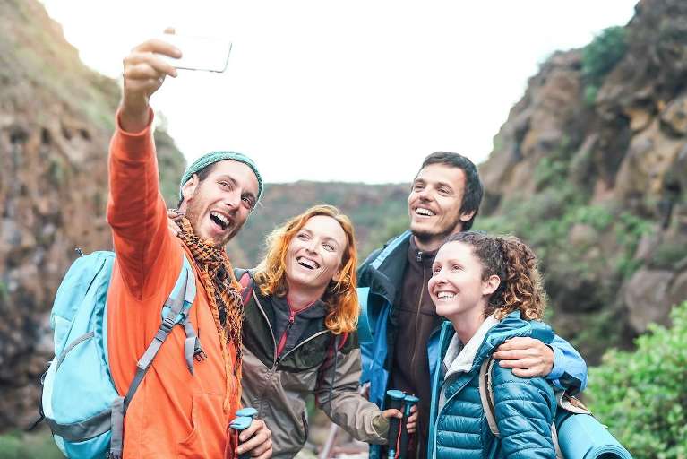 Group of people taking a selfie together outdoors, fort collins co