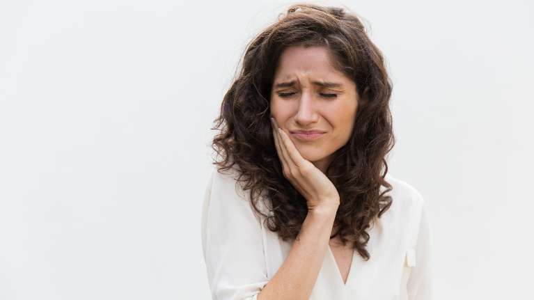 woman in pain before root canal, fort collins co