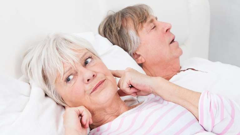 Older woman plugging her ears, fort collins co