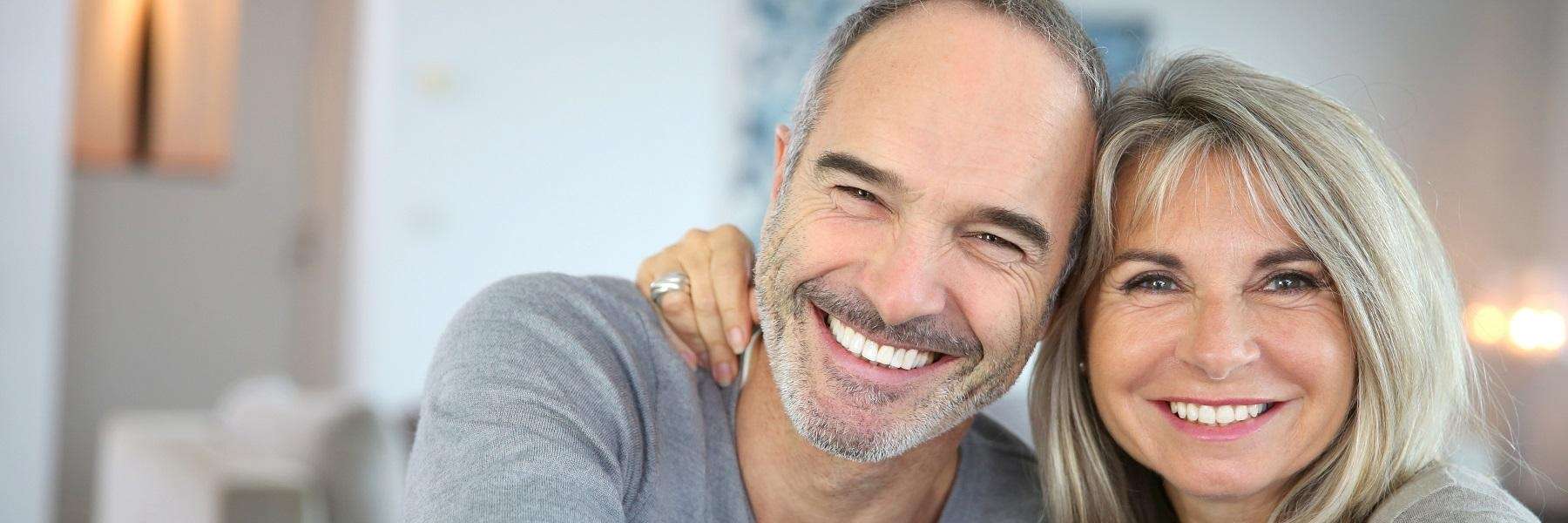 A couple smiling in their home | Fort Collins Dentist