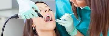 Woman receiving a Dental Checkup | Ryan Rush DDS Fort Collins