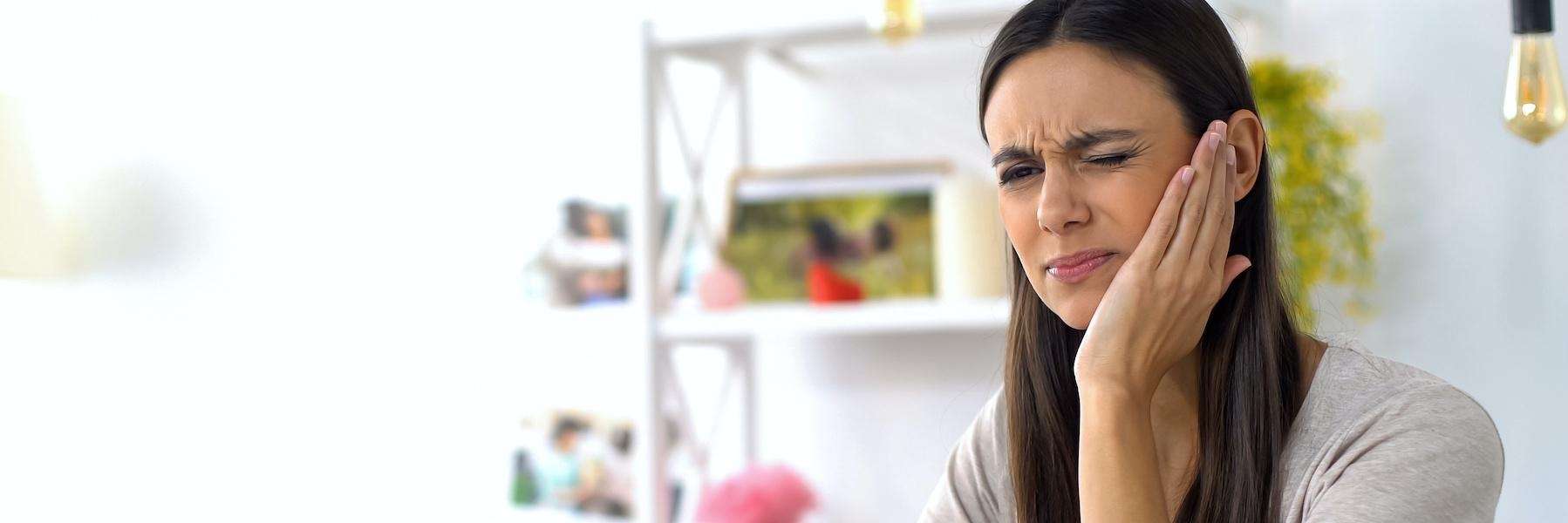 Woman with a toothache | Root canal Fort Collins