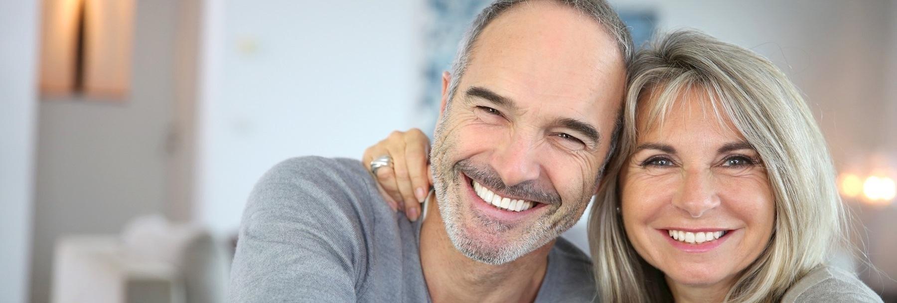 couple smiling after dental crowns in Fort Collins, CO