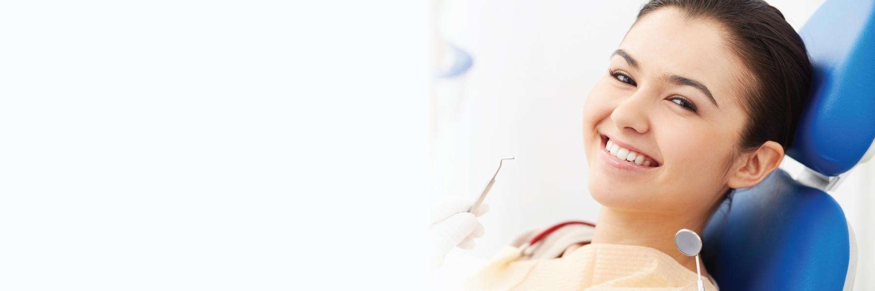 woman smiling after dental filling in Fort Collins, CO